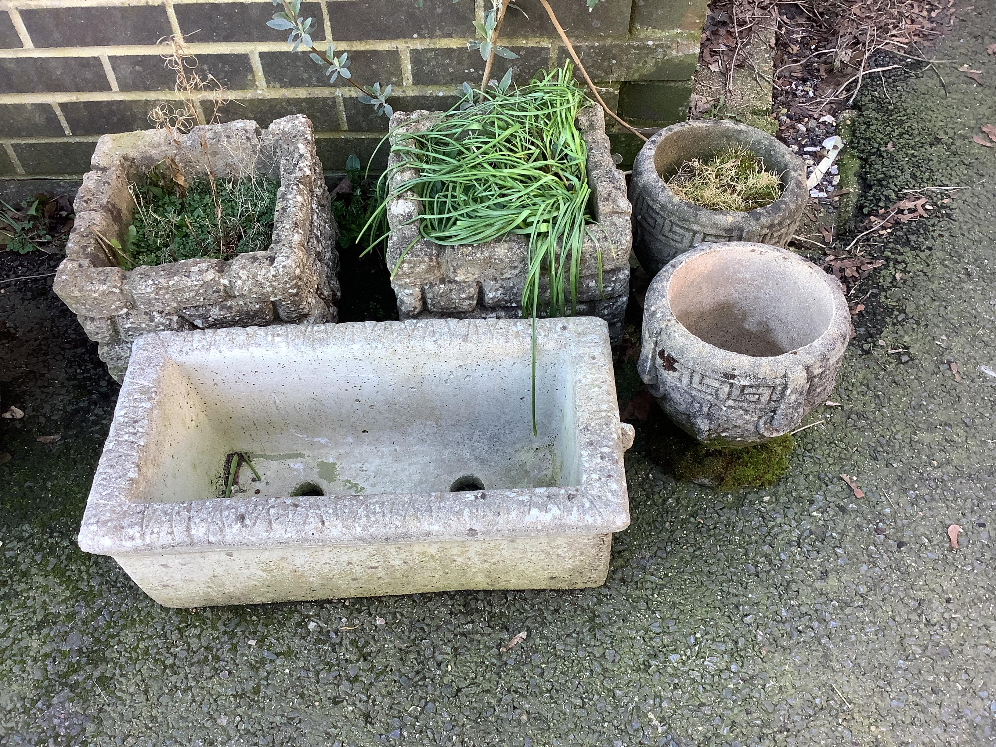 Five assorted reconstituted stone garden planters, largest width 58cm, height 21cm